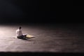 Conceptual Photo, Sitting Muslim, Islam People Reading Al Quran, at Wooden Floor