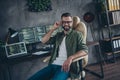 Photo of skilled nerd guy touch specs remote distance work java script write code platform optimization sit desk in Royalty Free Stock Photo