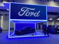 Blue Ford Mustang and Sign at the Auto Show