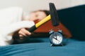 Photo of sleeping woman beating with hummer alarm clock