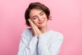 Photo of sleepy happy nice young woman wave hands face asleep good mood isolated on pink color background