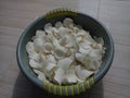 The photo of the sliced cassava is put in a bowl