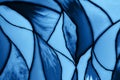 Photo of a small fragment of a beautiful stained glass in trendy blue color. Mockup for your design. Trendy background