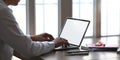 Photo of smart man working as accountant while sitting and working with white blank screen computer laptop. Royalty Free Stock Photo