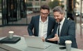 photo of smiling businessmen trading online. two businessmen trading online. Royalty Free Stock Photo