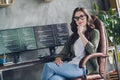 Photo of smiling clever lady coder dressed glasses solving bugs modern device indoors workstation workshop