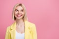 Photo of smiling dreamy lady wear yellow jacket suit smiling looking empty space pink color background