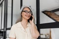 Photo of smiling gray-haired asian woman talking on mobile phone Royalty Free Stock Photo