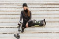 Photo of smiling handicapped woman in sportswear with prosthetic