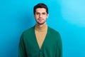 Photo of smiling happy man wear green cardigan spectacles smiling isolated blue color background Royalty Free Stock Photo