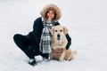 Photo of smiling woman with dog in winter park Royalty Free Stock Photo