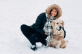 Photo of smiling woman with labrador in winter park Royalty Free Stock Photo