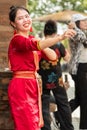 Photo of smiling young Vietnamese woman wearing red ao dai