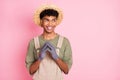 Photo of sneaky guy evil smile hold fingers look empty space wear straw hat beige overall isolated pink color background