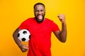 Photo of soccer team trendy african black funny captain wearing red t-shirt holding soccer ball prepared to win local