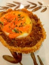 Photo of a soft-boiled egg cooked tempura-style, topped with mayonnaise sauce