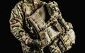 Soldier holding level 3 camouflaged armored vest