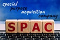 photo on spac special purpose acquisition company theme. wooden cubes with the abbreviation `spac`