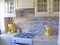 Photo of spacious wooden kitchen interior neat furnished ivory,