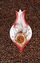 Photo of special coffee cup with coffee beans background