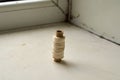 Photo of spool of white thread