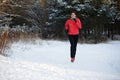 Photo of sports girl on morning run in winter park Royalty Free Stock Photo