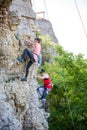 Photo of sports woman climbing mountain