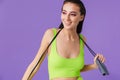 Photo of sporty joyful woman holding jump rope and smiling Royalty Free Stock Photo