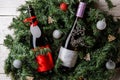 Photo of spruce branches with two bottles of wine, blank greeting card Royalty Free Stock Photo