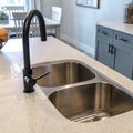 Photo Square frame Stainless steel undermount double basin kitchen island sink with black faucet Royalty Free Stock Photo