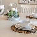 Photo Square Table setting on family dining room with tableware and round placemat Royalty Free Stock Photo