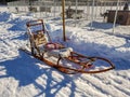 Photo of standalone wooden dog sled for dog sledding. Typical traditional old construction for winter racing in Lapland, Sweden Royalty Free Stock Photo