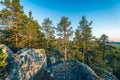Photo from the steep slope of the Northern Scandinavian forest in rocky mountains, big stones, yellow green trees at the end of Royalty Free Stock Photo