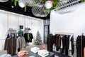 Photo of a store of youth, fashionable and stylish clothes with jeans, outerwear, jacket, shirts, sweater, t-shirt