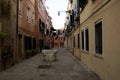 Photo of the street in Venice with loundry on the rope.