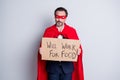 Photo of stressed displeased serious beggar mature dismissed business guy super hero costume hold carton placard need