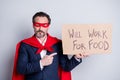Photo of stressed mature dismissed business guy super hero character costume direct finger carton placard need beg ask