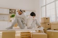 Photo of stressful couple get divorse, leave house, start living seperately, sit backs to each other, pose in kitchen, cardboard Royalty Free Stock Photo