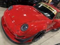 Striking Red Porsche Sports Car at the Auto Show