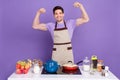 Photo of strong funky boyfriend dressed chef outfit showing arms muscles isolated purple color background