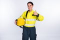 Photo of strong positive young fire lady workwear holding yellow helmet showing thumb up isolated white color background Royalty Free Stock Photo