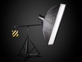 Photo studio lighting stands with flash and softbox isolated on the black Royalty Free Stock Photo