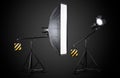 Photo studio lighting stands with flash and softbox isolated on the black Royalty Free Stock Photo