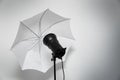 Photo studio lightning - strobe flash with white umbrella Royalty Free Stock Photo