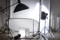 Photo studio with lights and white background