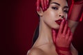 Photo of stunning asian woman femme fatale touch lips seduce romantic shoulders off  dark red color background Royalty Free Stock Photo