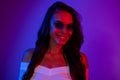 Photo of stunning mysterious lady toothy smile wear sunglass shirt dark neon gradient color background