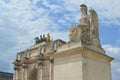 Stunning old statue in front of Arc de Triomphe in Louvre museum in Paris, France