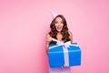 Photo of stunning young lady celebrate her birthday open huge package box isolated on pink color background Royalty Free Stock Photo