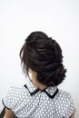 Photo of a stylish female hairstyle, on the back of the girl's head. Image for your creative decoration